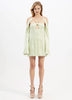A woman in Alice McCall Night Sky Mini Dress