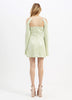 A woman in Alice McCall Night Sky Mini Dress