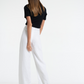 Woman in Bow & Arrow Margot Linen Flare Pant Chalk